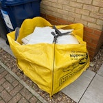 Tiles in a midi hippo bag for removal and disposal