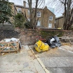 garden waste and broken paving for removal and disposal