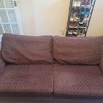 2 seater sofa, 1 leg bent for removal and disposal
