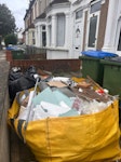 1 hippo bag & a few bin bags 1x hippo bag of DIY waste incl.
laminate floorboards, foam, cardboard boxes, dismantled kitchen fittings, etc. ~10 bin bags of domestic household waste SE2 - removed for £200