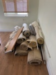 Pulled up carpet and shelf Carpet, underlay, gripper rods, a shelf, some old piping, scrap wood and plastic E18 - removed for £100