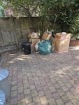 90% cardboard boxes, 90% cardboard boxes, the black bin is not included (just for scale) the green garden bag has a garfen waste and a few broken tiles. SW18 - removed for £70