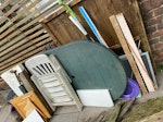 mix of light garden stuff +doo 7 bits of light rotten fence
one flat plastic chair and table
plastic stool
mop
cushion
cabinet door
one internal door

2nd pic is same as the first but with bit of fence in front N4 - removed for £110