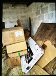 wood and cardboard Rotten wooden garage floor dismantled, empty cardboard boxes and chest of drawers SN2 - removed for £135