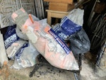 bags of broken floor tiles Around 15 rubble sacks - some full, some part-full - of broken floor tiles and general DIY rubbish. The bags are too heavy for me to separate out from other items in the garage, so the photograph is a little misleading. SE19 - removed for £100