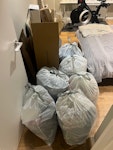 6 bin bags, 2 cardboard boxes 6 bin bags largely filled with old clothes, 2 cardboard boxes SW6 - removed for £45