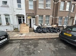 Garden rubble and scrap wood black bags filled with soil and concrete rubble. 2 pallets and scrap wood. SW16 - removed for £180