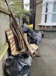 mostly garden waste from pavement to the yellow bag (do not take the yellow bag) 1x general waste, folded up boxes & wood fencing panels, approx 25 bags of garden waste 
It’s a 24/7 manned hostel, easy access N4 - removed for £150