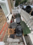 Junk from garden clear out Old garden fencing, wooden posts, metal scrap, old flooring, old recycling tubs, and some bin bags with garden waste in them W10 - removed for £70