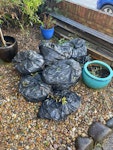 10 bags garden + decking 10 bags approx garden waste and pile of old decking boards - decking boards up to 2.4m. easy access in front garden TW18 - removed for £90