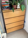 chest of drawers and desk Large light brown chest of drawers and a smaller sized glass top desk with white framing. W11 - removed for £0