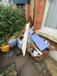 building waste. Building waste comprising of approx 15-20 rubble bags of rubble and misc rubbish. wood off cuts, plaster coving offcuts, old mops and bins. E5 - removed for £160