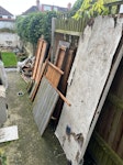 Old shed with carpet + window It's an old shed that's been broken down into smaller bits of wood. A few bits of rolled up carpet and two small glass windows from the shed. SE23 - removed for £110