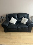 2 seater black leather settee Black leather 2 seater settee with 2 armchairs and leather footstool. No Fire Labels except on the base of the Foot Stool. In very good condition. CM2 - removed for £200