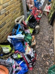 Soil, rubble, mattress, junk Soil, rubble, stones and garden waste, odd metal items, junk - all bagged up. Broken pots and tubs. Lady's bike, double mattress, huge bean bag, chair. SW13 - removed for £210