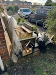 iron bath,bags,tiles,wood. Heavy cast iron bath cut in two.Vanity unit,bags of tiles wood and cardboard,few bits of wood,small bath screen EX3 - removed for £120