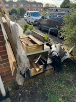 iron bath,bags,tiles,wood. collected by UKWASTESERVICES LIMITED