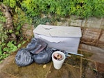 garden waste Empty broken storage box, three bags of garden rubbish, a few old pots and a small parasol W7 - removed for £65