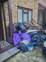 Garden waste,soil, tiles, wood collected by Universal N&D LTD