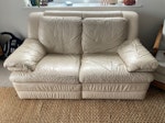 2 seat leather reclining sofa some wear and tear on the seat 
Full working order 
Reclining on one side 
Cream leather 
Two seater DA8 - removed for £85