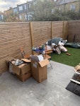 cardboard and polystyrene flattened cardboard boxes and bags of associated waste SW19 - removed for £75