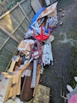 Pile of builders/random junk Hello, We have a pile of random rubbish - builders/wood/metal/a few old chairs/books/2 small draw cabinets/cardboard/small amount of insulation/plaster board/rusty metal saw horse/bent gazebo frame and covers plus other random bits. Access is clear but it is in the back garden and the route down the side of the house is about 10-15m. thanks. KT16 - removed for £190