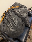 Two bags of plastic, cardboard Cardboard and two, light bin bags of plastic W4 - removed for £35