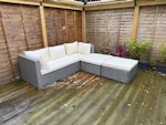 Outdoor furniture Flat pack cupboard (already disassembled); outdoor cupboard, wooden round cable roll, outdoor umbrella stand, outdoor rattan sofa with cushions, outdoor storage box with wooden bistro set inside, garden refuse (as shown on photo of external storage box) BN3 - removed for £180