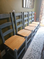 8 wooden dining chairs collected by M&V waste Clearence