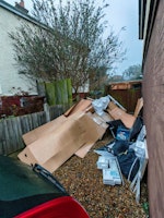 A pile of cardboard and other collected by JunkMove