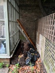 door, barrel, other rubbish Door, ladder, 2 fern tree trunks, bags of rubble, broken barrel N1 - removed for £90