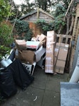 3x boilers + boxes and plumbin 3x old boiler scrap and some pipework + flues and cardboard boxes. SW19 - removed for £70