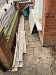 Timber and old bins Nine pieces of timber of various lengths and sizes, and two old bins (one recycling, one dustbin) with lids. N5 - removed for £40