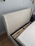 A bed frame taken into pieces It’s a grey fabric bed frame in pieces to be taken away from street level NW6 - removed for £70