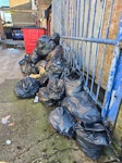 Bags of roof grass/moss We cleaned the external roof and have put the green stuff (like grass) in black bin bags.
It at the back of the building MK2 - removed for £200