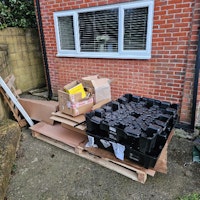 Wooden pallets&Tesla clamshell collected by Halls waste removals