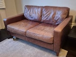 Sofa Leather sofa 86 x 100 x 156 cm. Still fine but has cosmetic damage e.g. cat scratches and colour has faded a bit in place. Collection from ground floor flat and we can help carry outside. BN2 - removed for £60