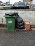 mixed waste green waste plus bags of soil, cardboard boxes, plastic screenwash bottle, contents of bin BN10 - removed for £55