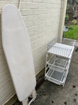 Household items /tv Ironing board, two wire trolleys with fitted baskets (one rusting and another in useable condition), two grey wire baskets and a broken 43 in tv. E17 - removed for £50