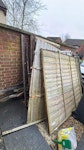 12 broken fence panels / slats 10 - 12 broken fence panels and some loose boards - All outside in the front for ease of access SN10 - removed for £190