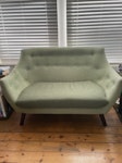 2-seater sofa Cute midcentury-style 2-seater sofa in green fabric, with dark wood legs. The covering fabric is a little damaged (see photos) but sofa itself is very comfy.
Would make a great upcycling / reupholstery project.
w130 cm, h90 cm, d80 cm BN1 - removed for £50