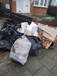 waste bags and wood 19 bags of old tiles some wood 2 small.plaster boards HA8 - removed for £120