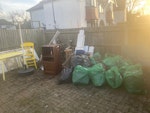 Garden,furniture,rubbish,glass Several bags of garden waste and general waste, broken doors and windows, a glass sliding door, a glass shower panel, a desk, chair, shelving, a cabinet, a parasol stand and general rubbish- some can potentially be reused CR7 - removed for £160