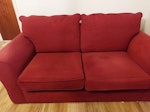 Sofabed Red sofa bed. Bed section comes out of base for ease of carrying. The four large cushions (seat and back cushions) are loose, so easy to move. On my driveway at the front of the property, so is easy to pick up. TQ2 - removed for £50