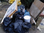 Waste from building work Plasterboard, window frame, plywood, plastic sheeting, old door [NOT the building materials in the yellow bags] N8 - removed for £150