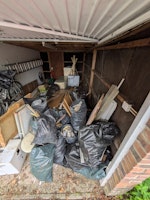 Rubble sacks and floorboard collected by T & O waste services