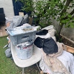 wood, rugs, chair and more wooden futon frame, chair, 2 large rugs, empty pain cans and concrete, dust sheets, other small plastic things like plant pots etc SE23 - removed for £81