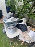 wood, rugs, chair and more wooden futon frame, chair, 2 large rugs, empty pain cans and concrete, dust sheets, other small plastic things like plant pots etc SE23 - removed for £81