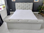 Upholstered Bed The frame is in really good condition. The mattress is thin and usable. There
is one circular stain on the mattress, which can be covered with a mattress protector. S11 - removed for £80
