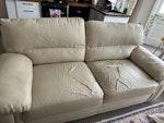 Sofa (White faux leather) Comfy white faux leather sofa. Seats 2-3. It is ripped but this can be covered easily. BN1 - removed for £80
